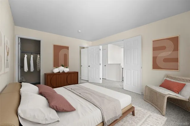 a bedroom with a bed and a couch