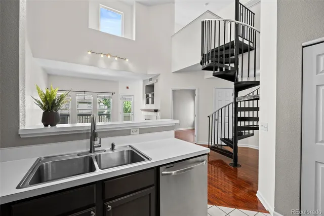 a view of a kitchen from a hallway