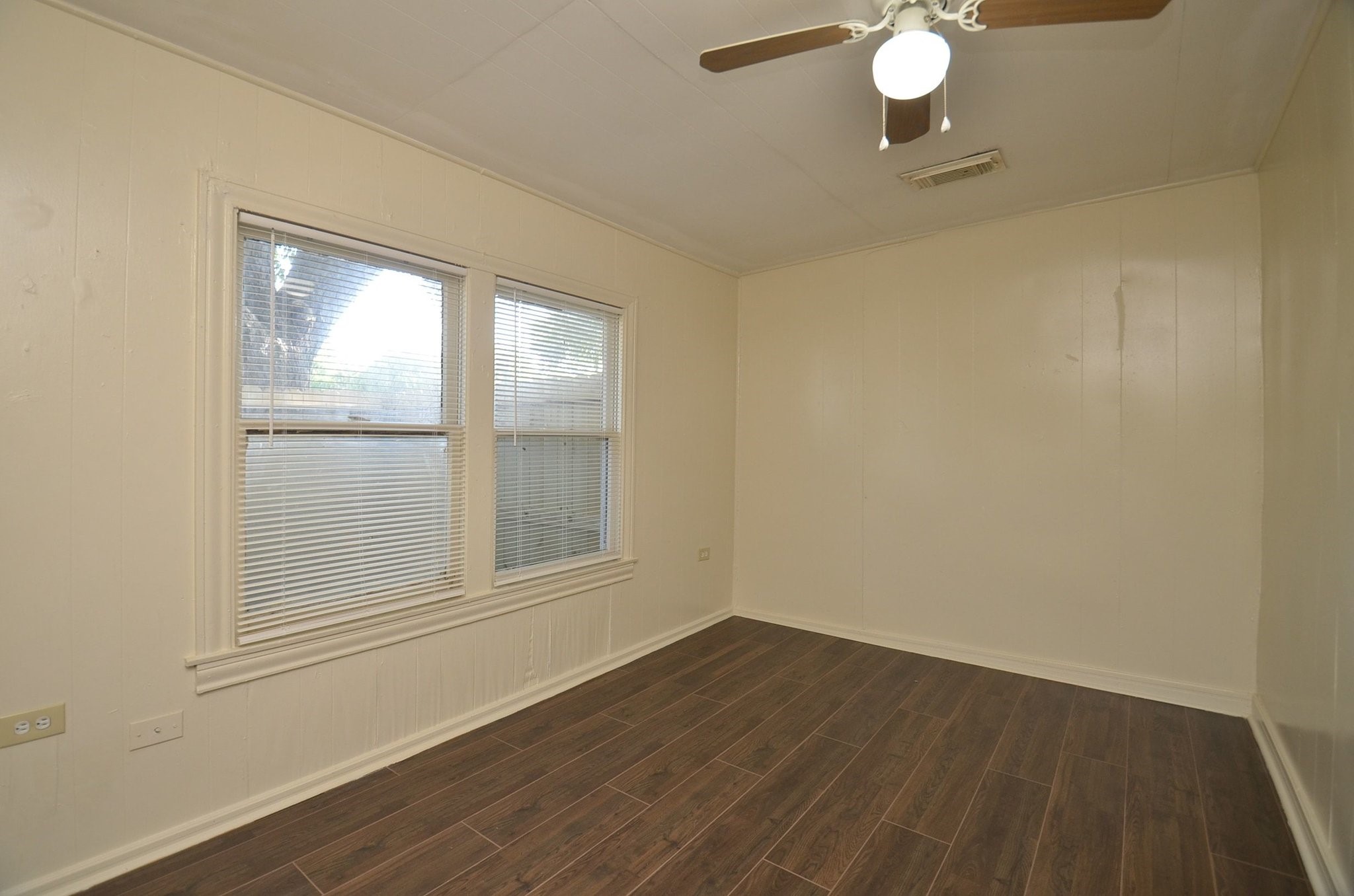 1600 5th Street Rosenberg, TX 77471 - Photo 15 of 24 Spacious primary bedroom with multiple windows.