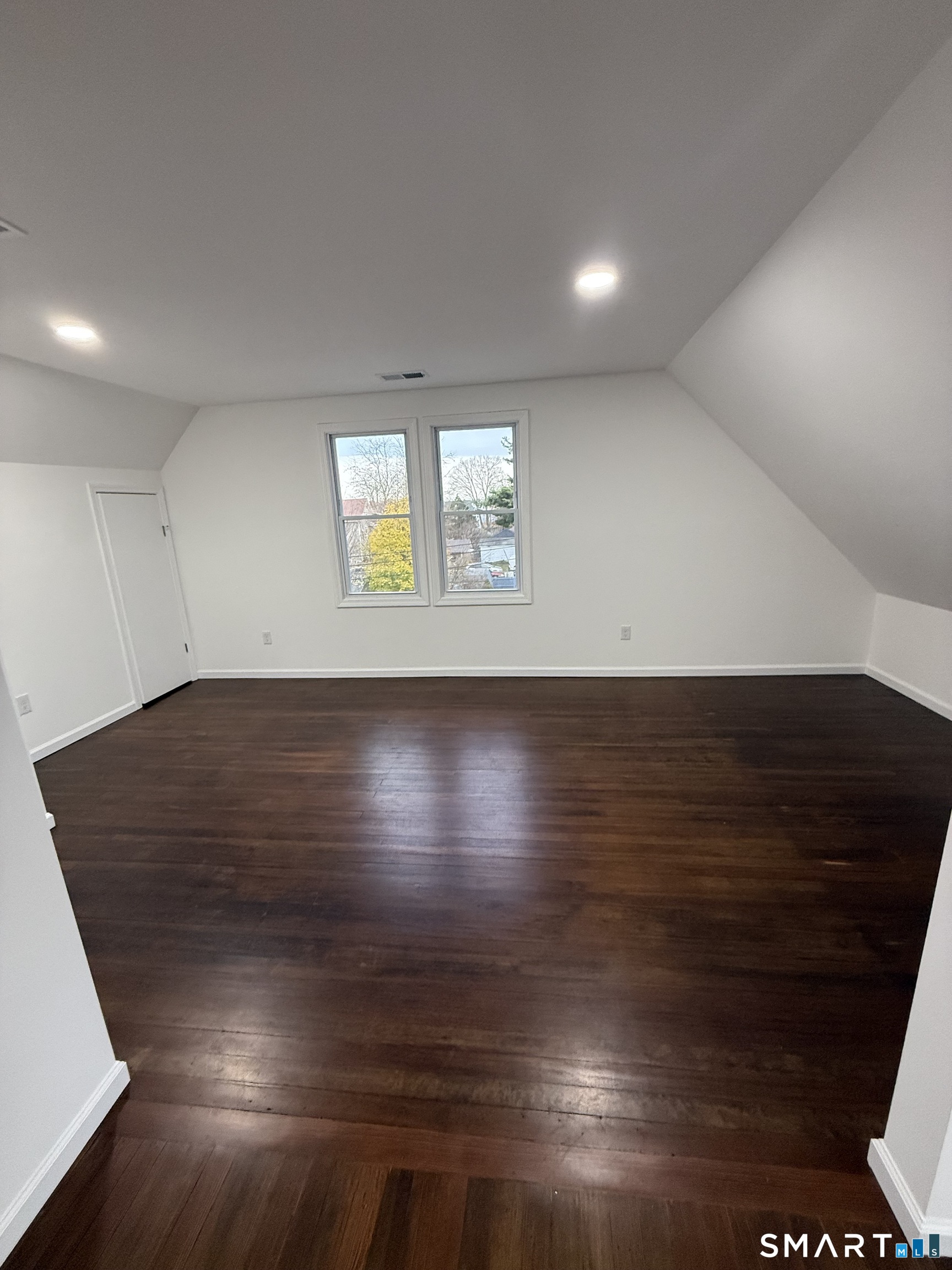 10 Cross Street Hamden, CT 06514 - Photo 7 of 7 an empty room with wooden floor and windows
