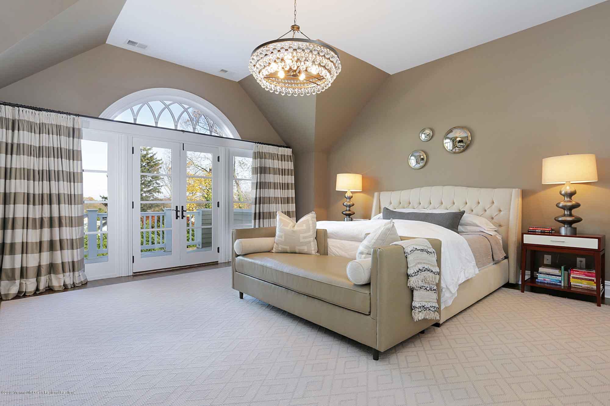 3 Sugar Maple Lane Rumson, NJ 07760 - Photo 15 of 33 a spacious bedroom with a bed and a large window