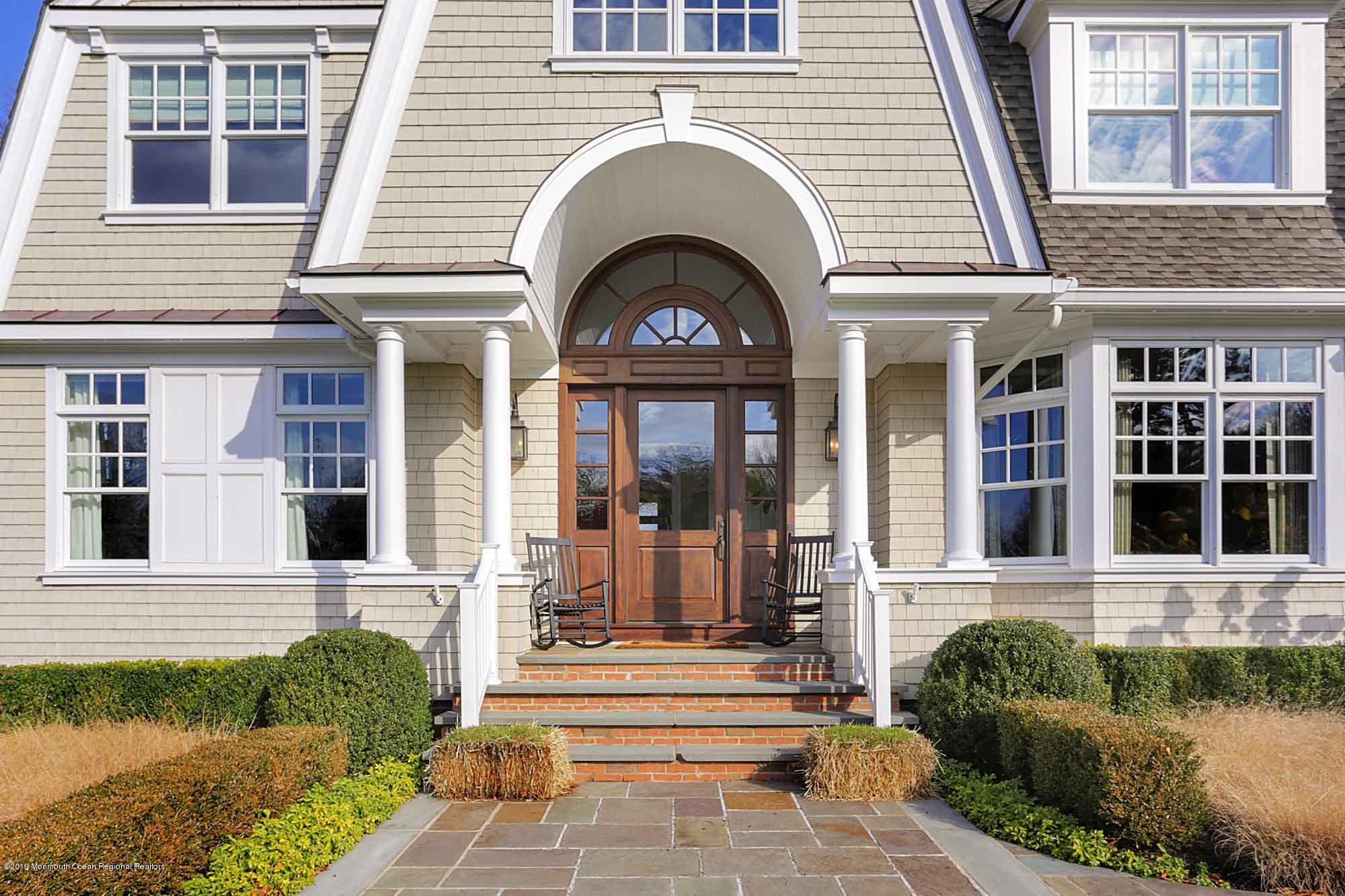 3 Sugar Maple Lane Rumson, NJ 07760 - Photo 3 of 33 a front view of a house with a garden