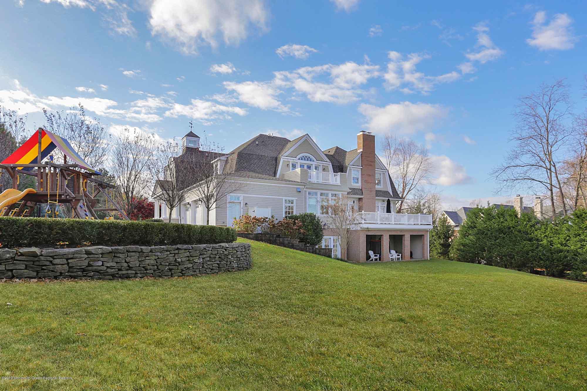 3 Sugar Maple Lane Rumson, NJ 07760 - Photo 24 of 33 a front view of a house with a garden