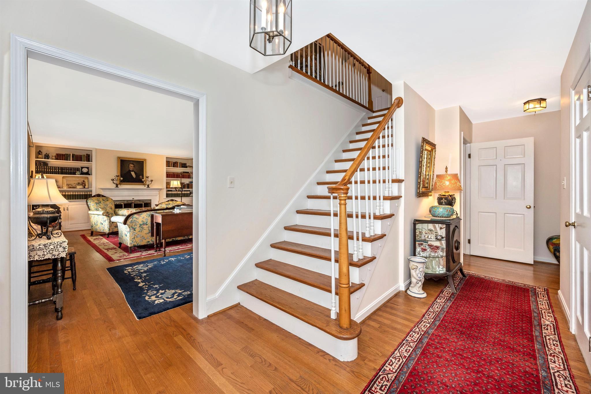 7411 Round Hill Road Frederick, MD 21702 - Photo 9 of 71 Hardwood stairs leading to the second story