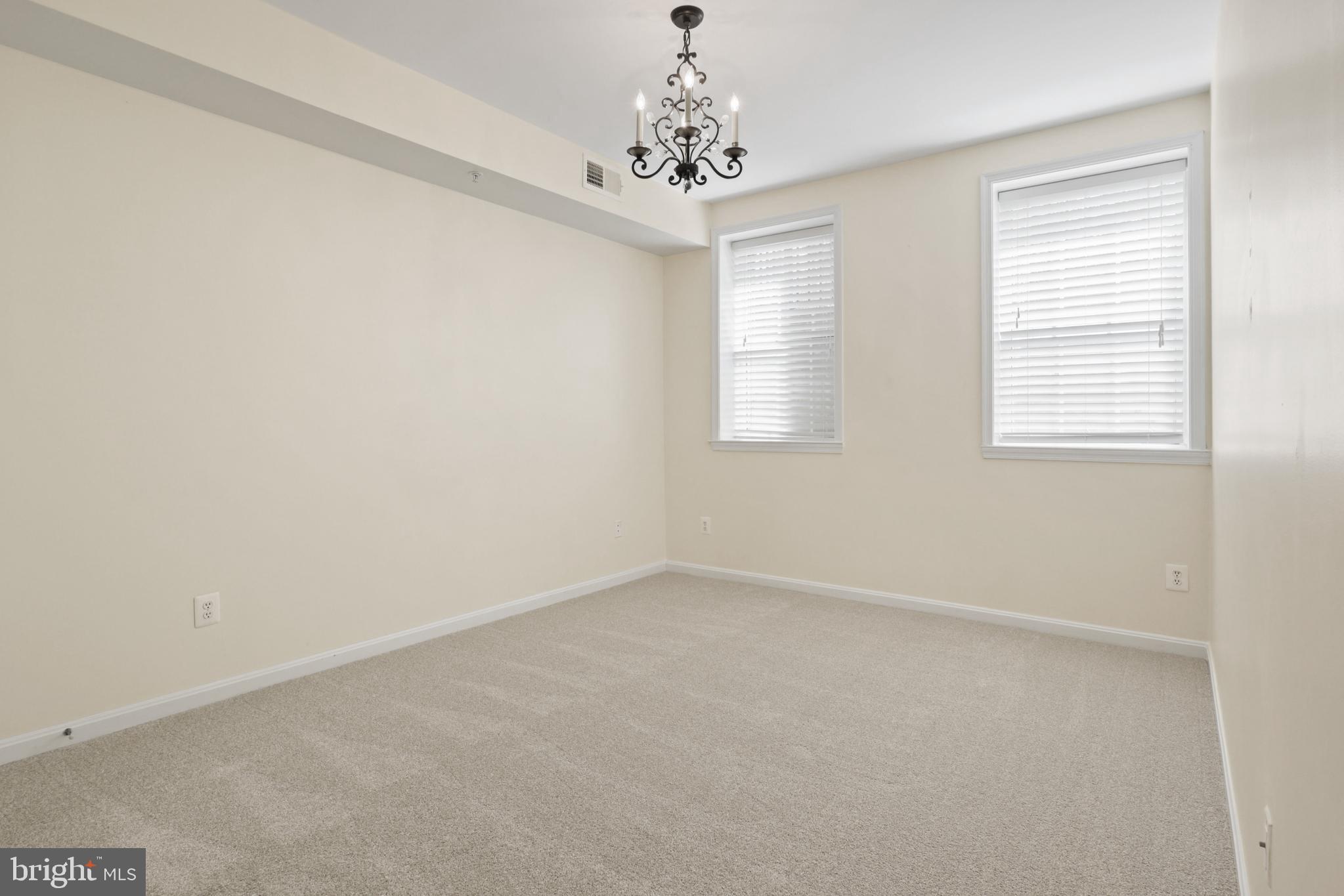 11313 Sundial Court, Unit 208 Reston, VA 20194 - Photo 23 of 30 Primary Bedroom has natural light and new carpet