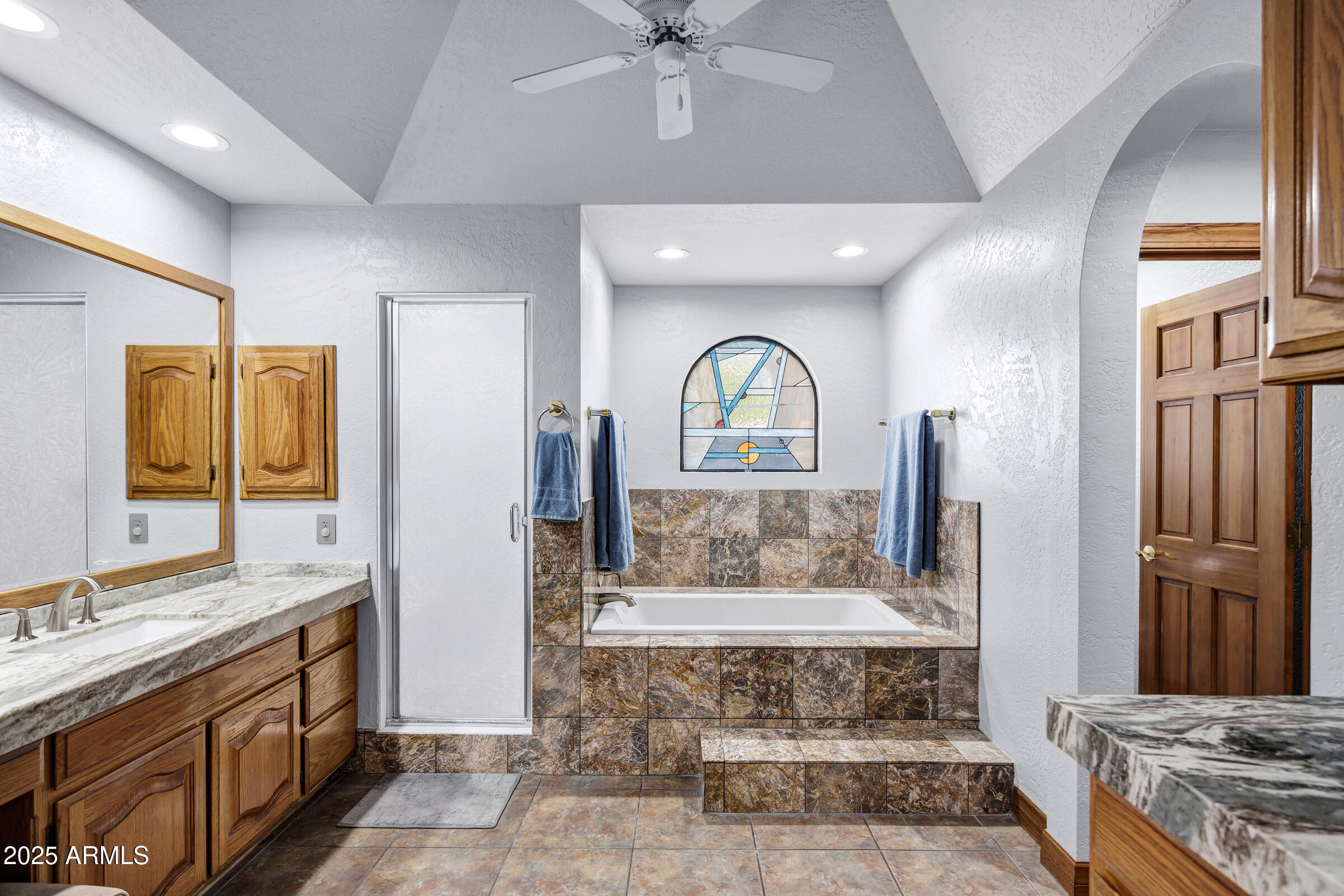 322 East Gary Circle Mesa, AZ 85201 - Photo 31 of 48 a large spacious bathroom with a granite countertop sink a mirror and a