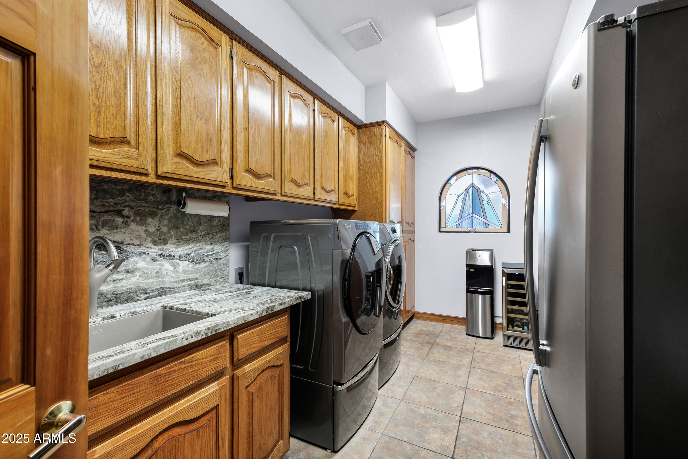 322 East Gary Circle Mesa, AZ 85201 - Photo 36 of 48 a kitchen with stainless steel appliances granite countertop a refrigerator and a sink