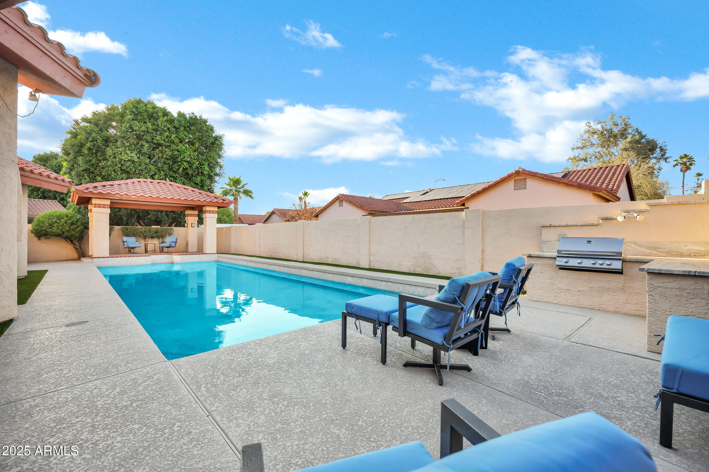 322 East Gary Circle Mesa, AZ 85201 - Photo 42 of 48 a backyard of a house with table and chairs