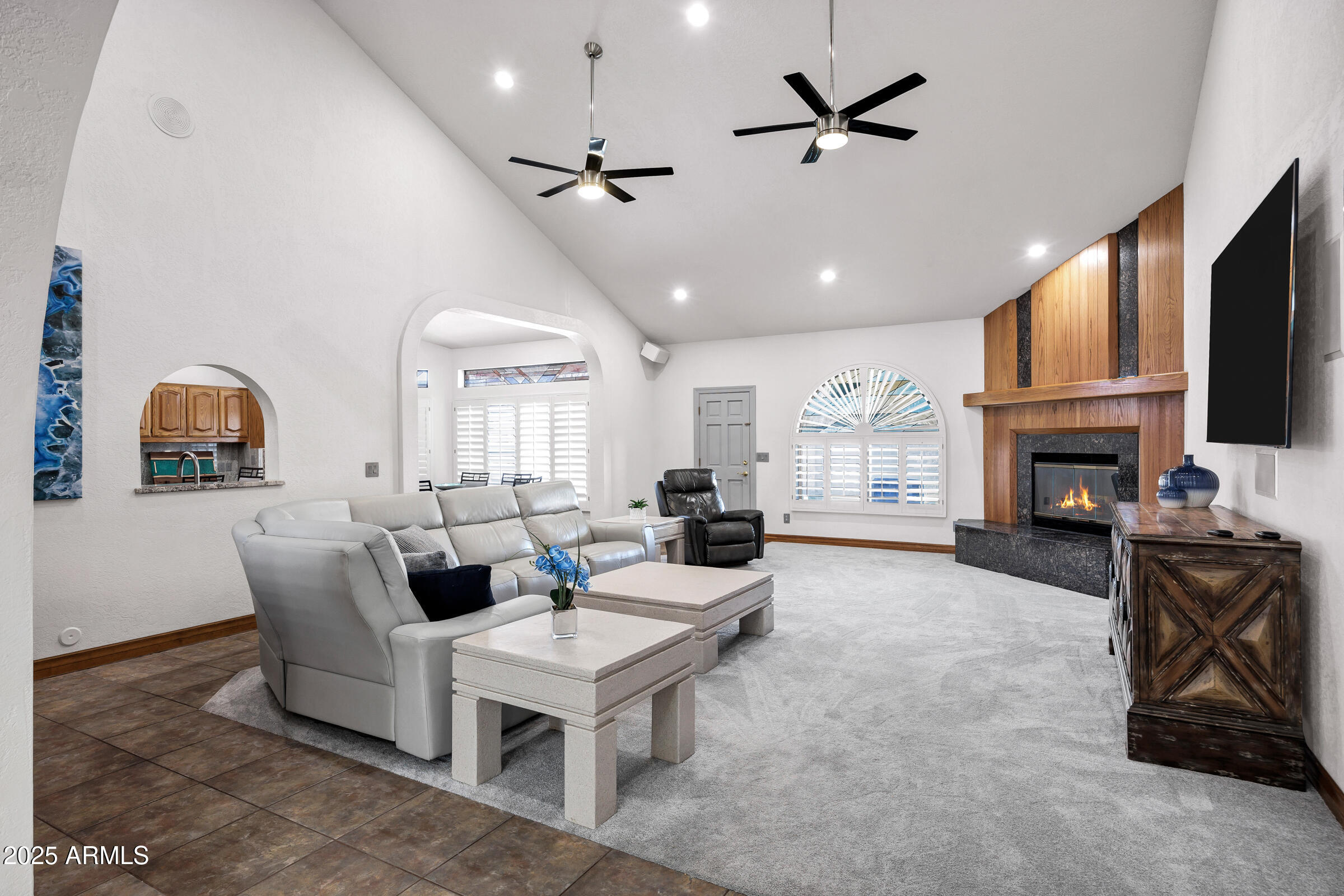 322 East Gary Circle Mesa, AZ 85201 - Photo 6 of 48 a living room with furniture a fireplace and a flat screen tv