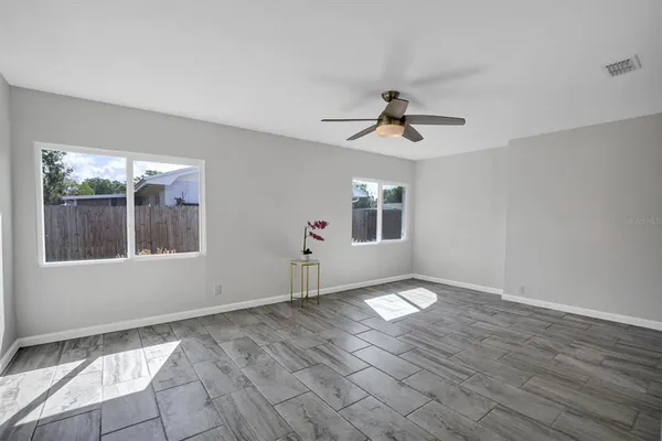 a view of an empty room with a window