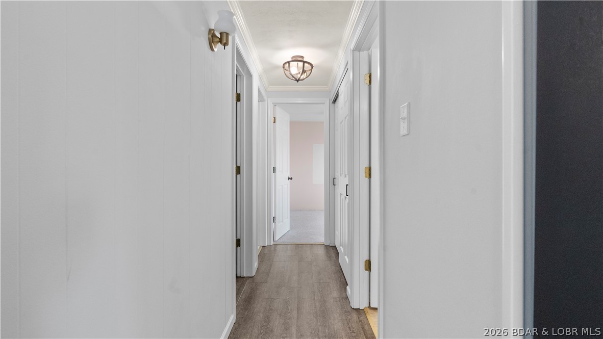 862 Malibu Road Osage Beach, MO 65065 - Photo 25 of 62 Main level hall way to bedrooms and bath
