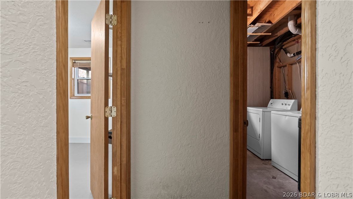 862 Malibu Road Osage Beach, MO 65065 - Photo 43 of 62 Utility room lower level with washer and dryer