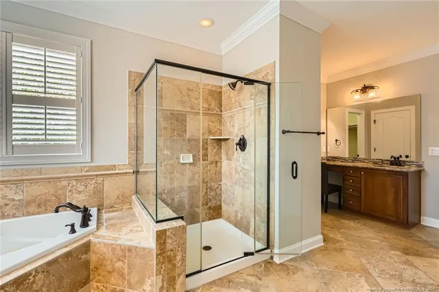 a bathroom with a tub shower and sink