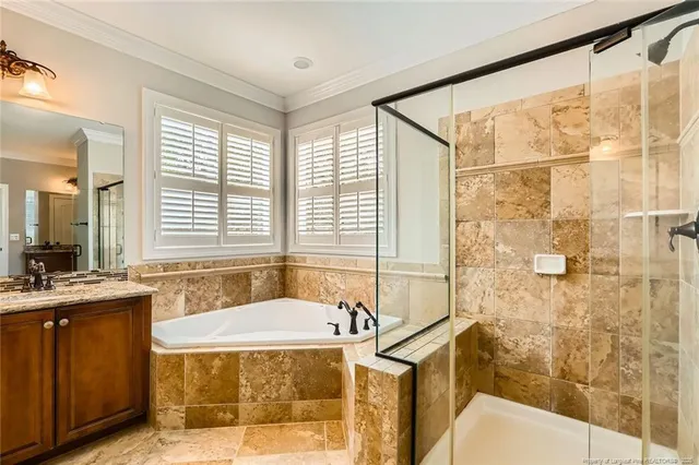 a spacious bathroom with sink shower and bathtub