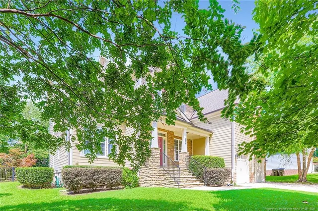 front view of a house with a yard
