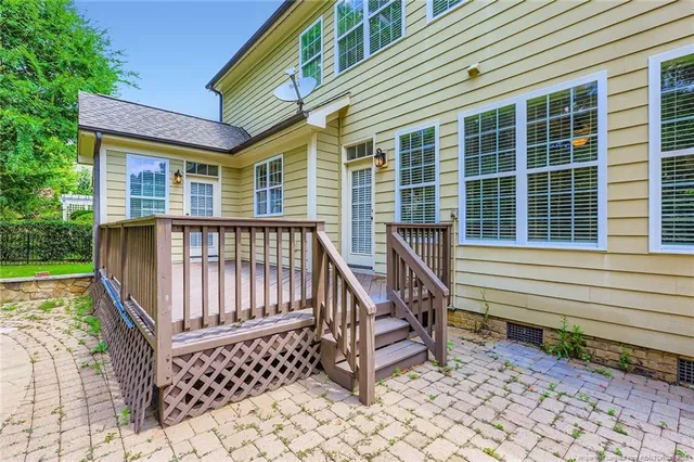 a view of a chair and tables in the balcony