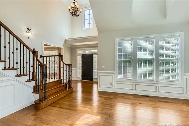a view of an entryway with wooden floor and door