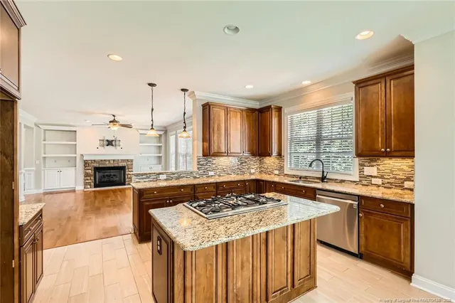 a kitchen with a stove sink and microwave
