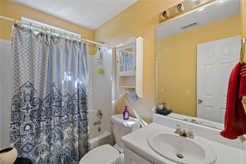 4220 Arrowhead Pointe Austell, GA 30106 - Photo 15 of 20 a bathroom with a sink toilet and shower