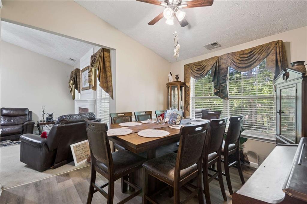 4220 Arrowhead Pointe Austell, GA 30106 - Photo 9 of 20 a view of a dining room with furniture window and wooden floor