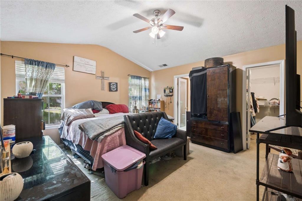 4220 Arrowhead Pointe Austell, GA 30106 - Photo 10 of 20 a bedroom with bed and wooden floor