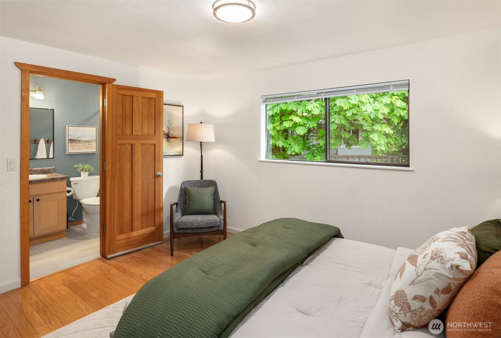 418 212th Street Southwest Bothell, WA 98021 - Photo 19 of 40 a bedroom with a bed and a chair