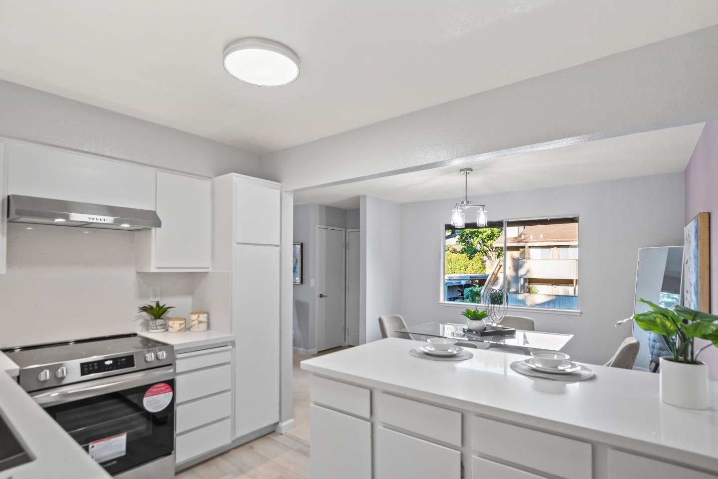 46867 Fernald Common Fremont, CA 94539 - Photo 13 of 23 a kitchen with a sink and white cabinets