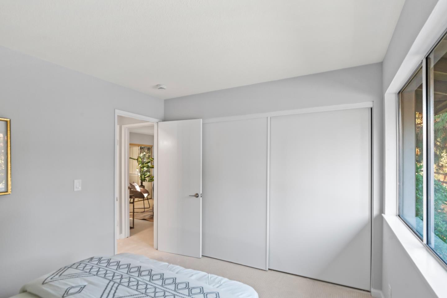 46867 Fernald Common Fremont, CA 94539 - Photo 15 of 23 a view of a bedroom with a hallway and wooden floor