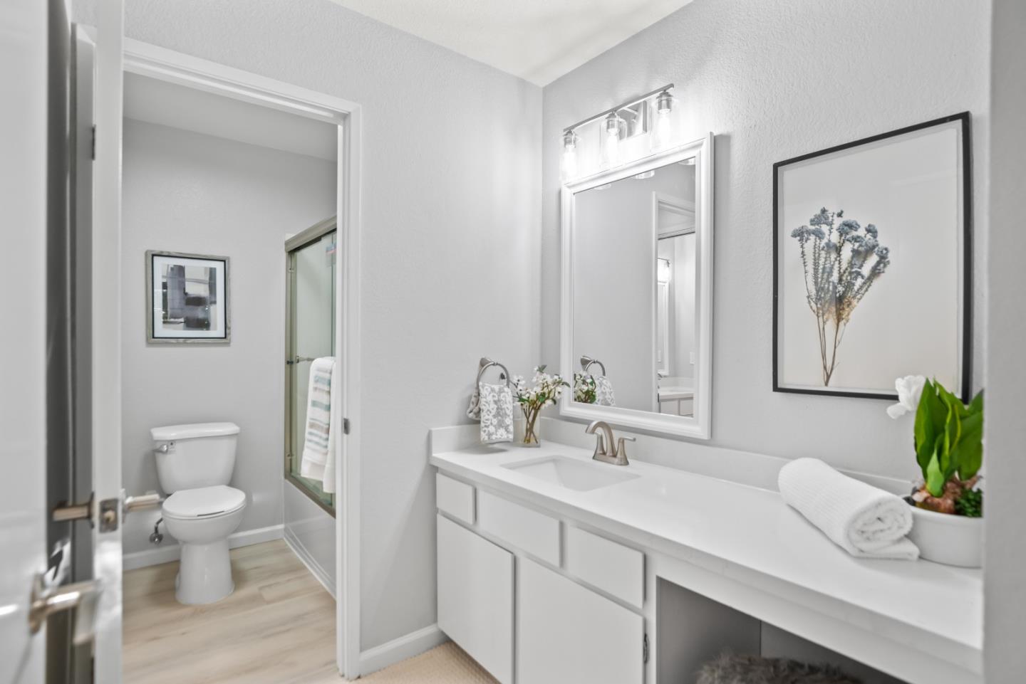 46867 Fernald Common Fremont, CA 94539 - Photo 18 of 23 a bathroom with a sink a toilet and a large mirror