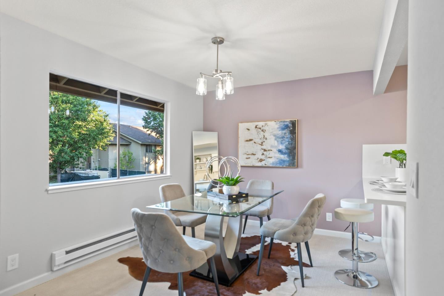 46867 Fernald Common Fremont, CA 94539 - Photo 6 of 23 a dining room with furniture a window and a chandelier