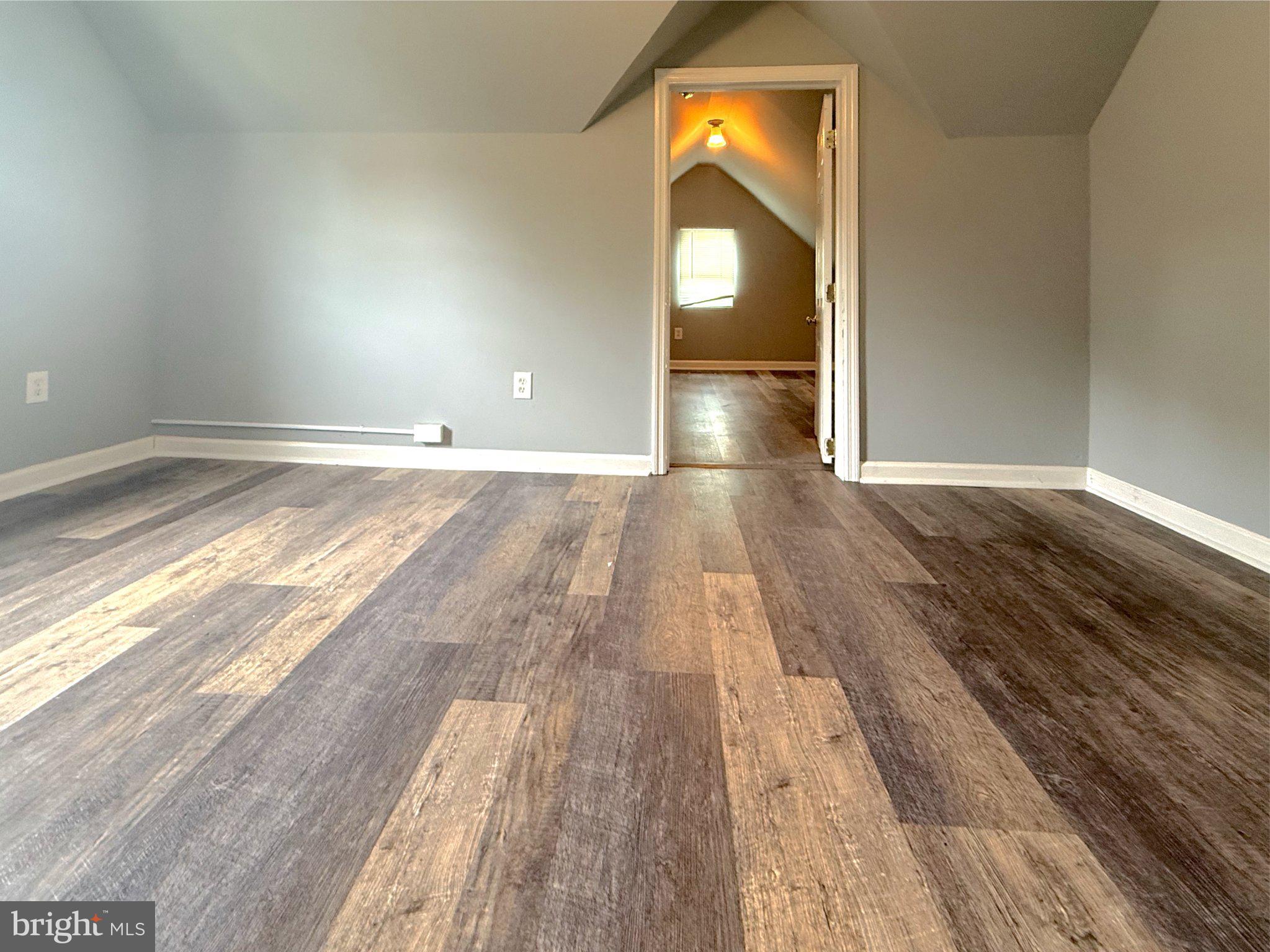 304 Collins Avenue, Unit 2 Baltimore, MD 21229 - Photo 10 of 17 Spacious, light-filled room awaits you.