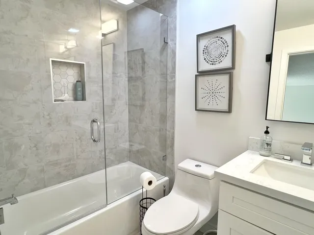 a bathroom with a toilet sink and bathtub