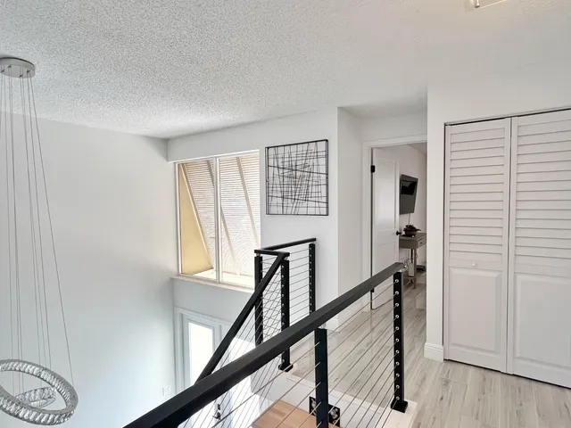 a view of entryway with a window and wooden floor