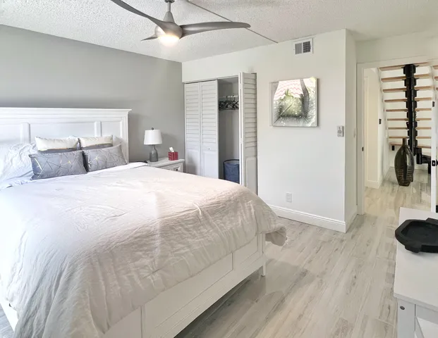 a large white bed in a white room