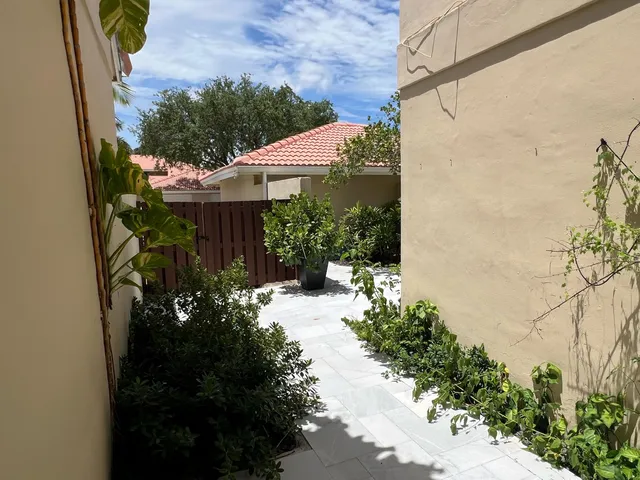 a view of a house with a flower garden