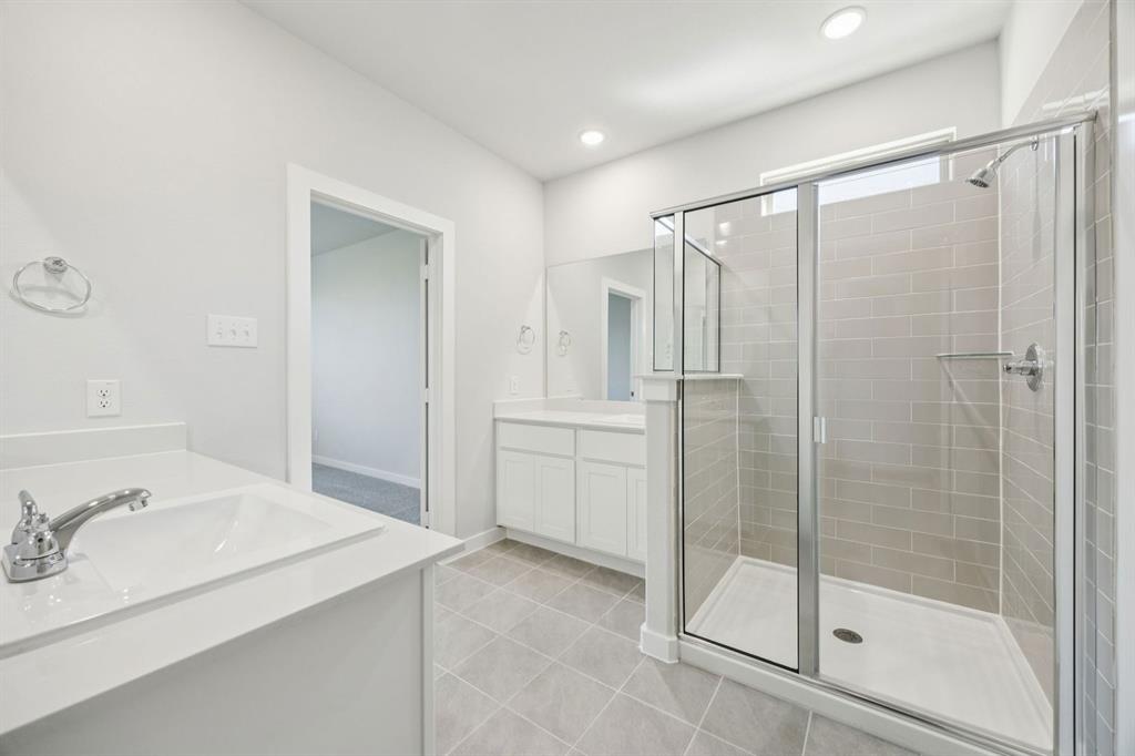 5803 Rushing River Way McKinney, TX 75071 - Photo 20 of 34 Primary Bathroom in the Masters home plan by Trophy Signature Homes – REPRESENTATIVE PHOTO