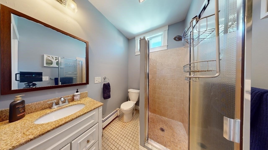 17 Gorham Road, Unit 2 Medford, MA 02155 - Photo 15 of 37 a bathroom with a granite countertop sink toilet and shower