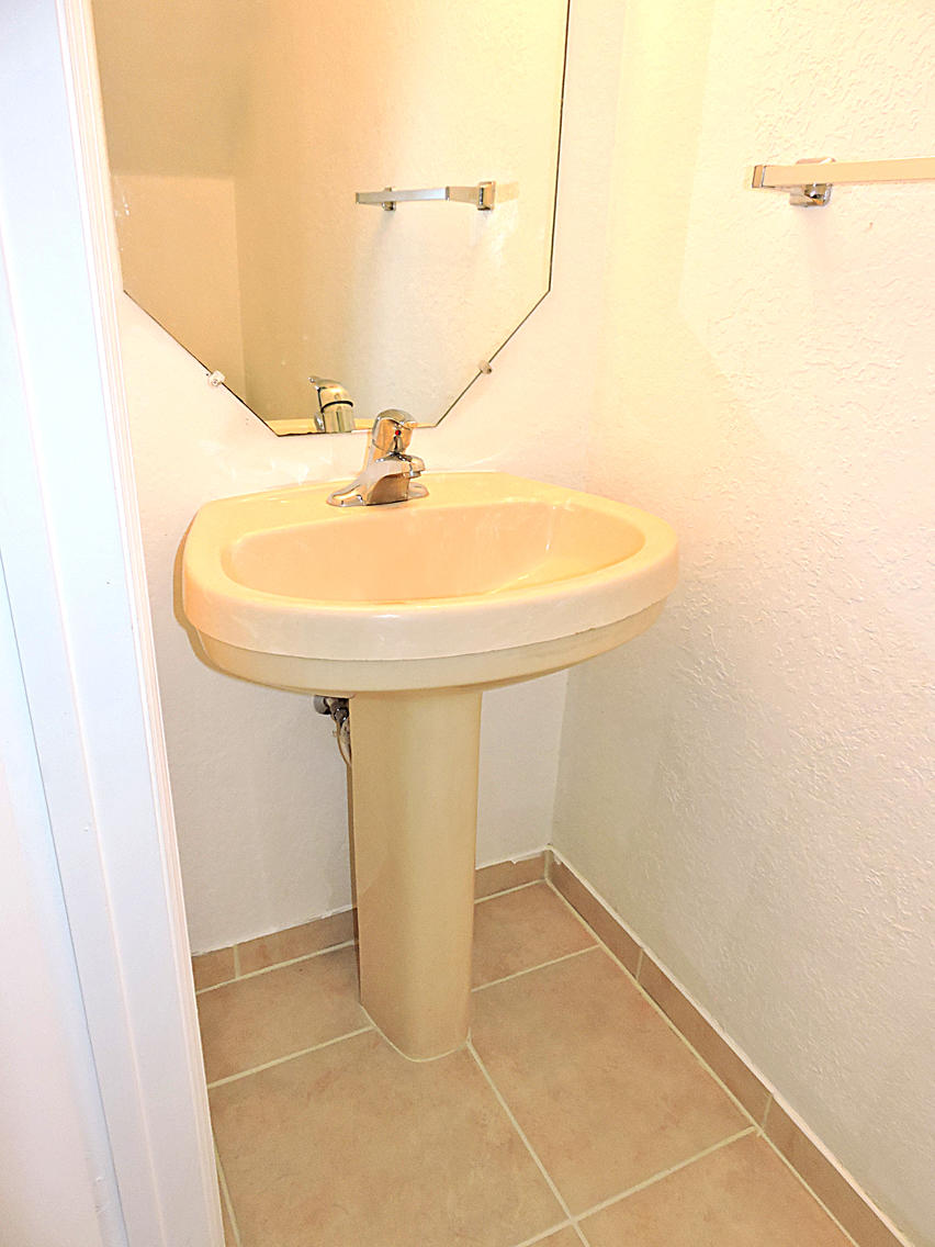 1986 Alamanda Way Riviera Beach, FL 33404 - Photo 15 of 49 a bathroom with a sink