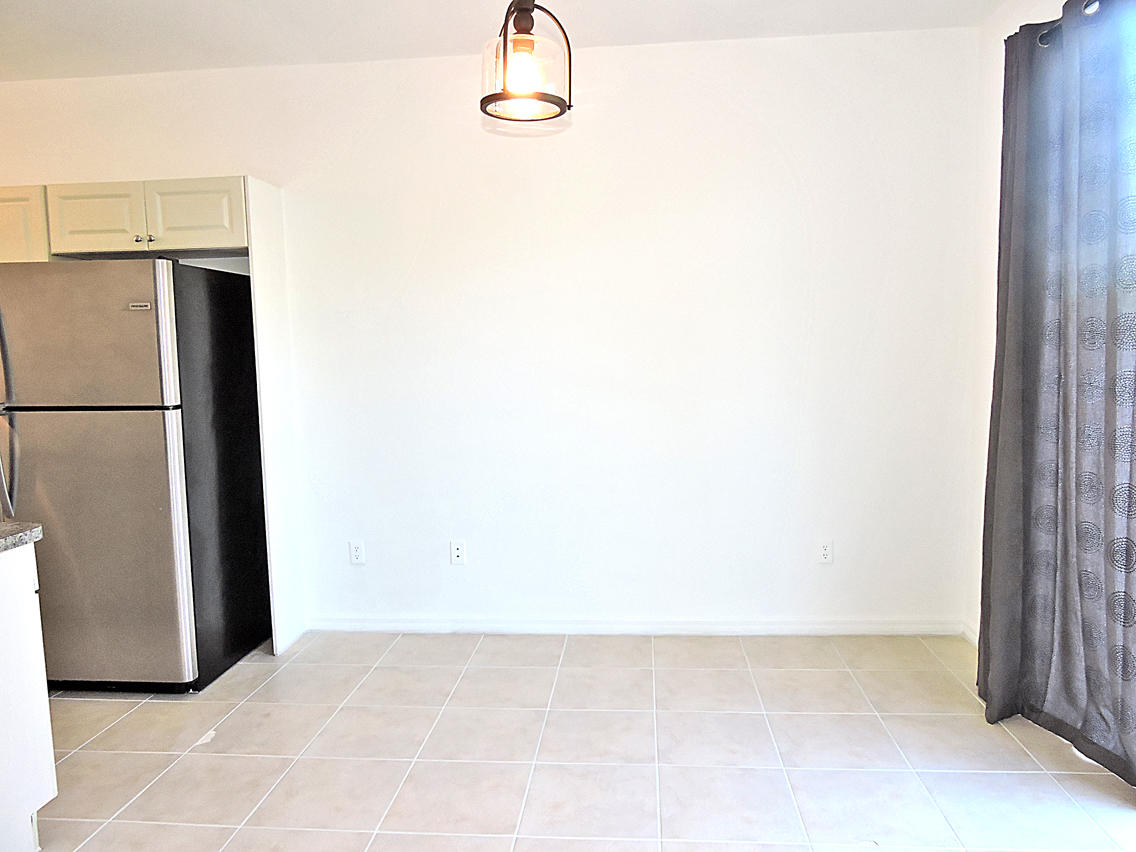 1986 Alamanda Way Riviera Beach, FL 33404 - Photo 19 of 49 a view of a refrigerator in a kitchen