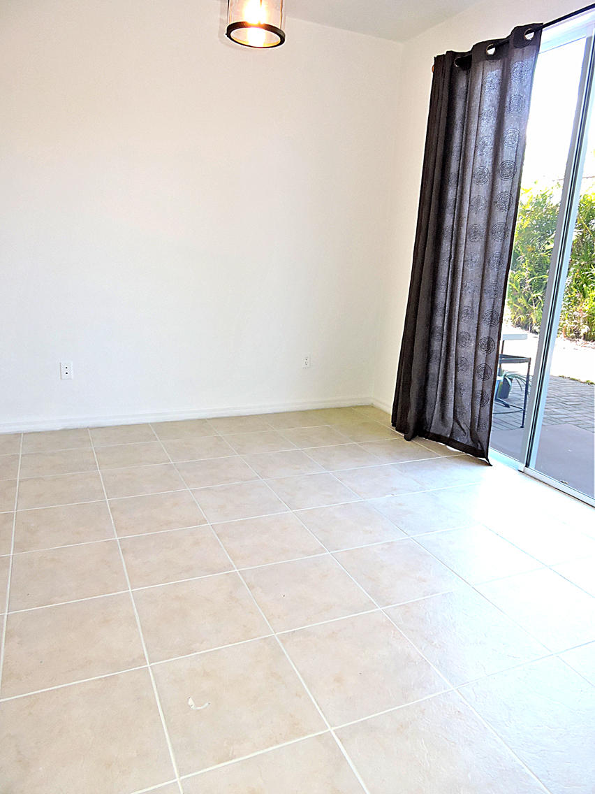 1986 Alamanda Way Riviera Beach, FL 33404 - Photo 20 of 49 an empty room with windows