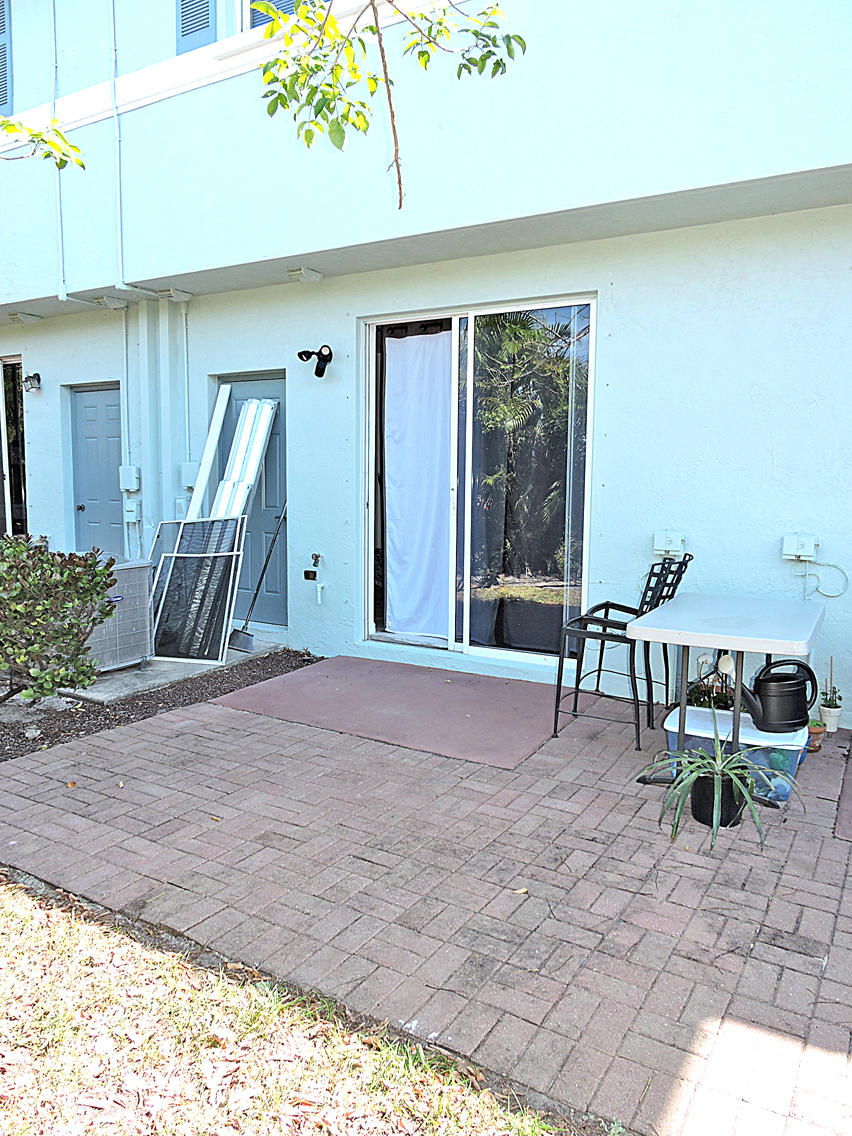 1986 Alamanda Way Riviera Beach, FL 33404 - Photo 23 of 49 a view of outdoor space with porch and outdoor seating