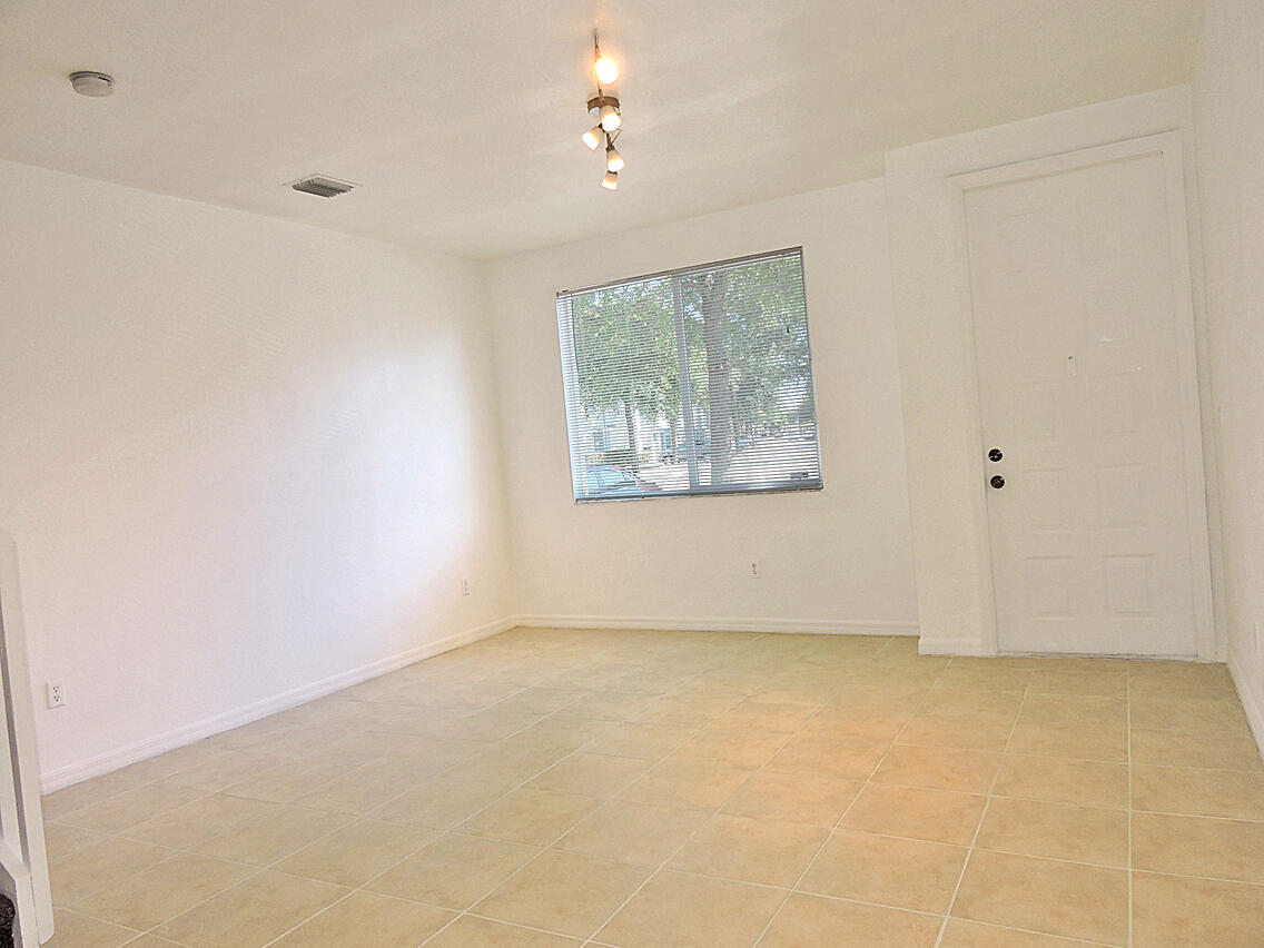 1986 Alamanda Way Riviera Beach, FL 33404 - Photo 28 of 49 an empty room with a window