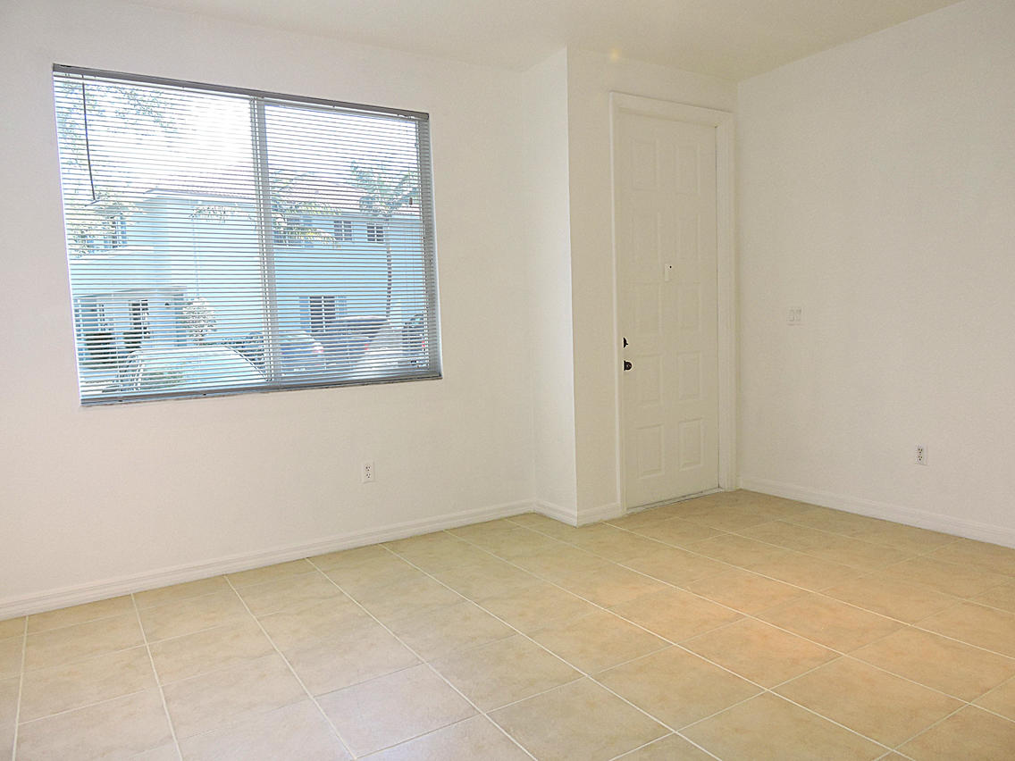 1986 Alamanda Way Riviera Beach, FL 33404 - Photo 29 of 49 an empty room with a window