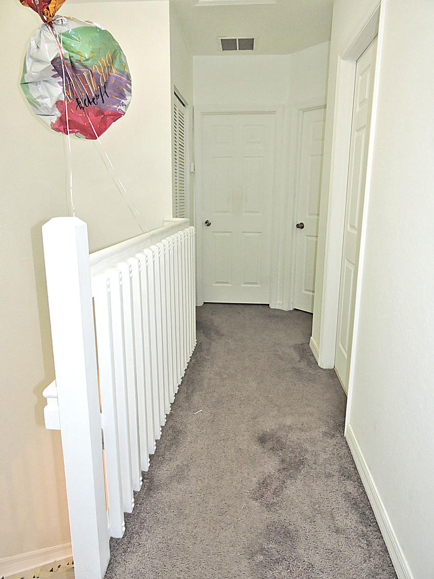 1986 Alamanda Way Riviera Beach, FL 33404 - Photo 37 of 49 a view of a room with wooden floor