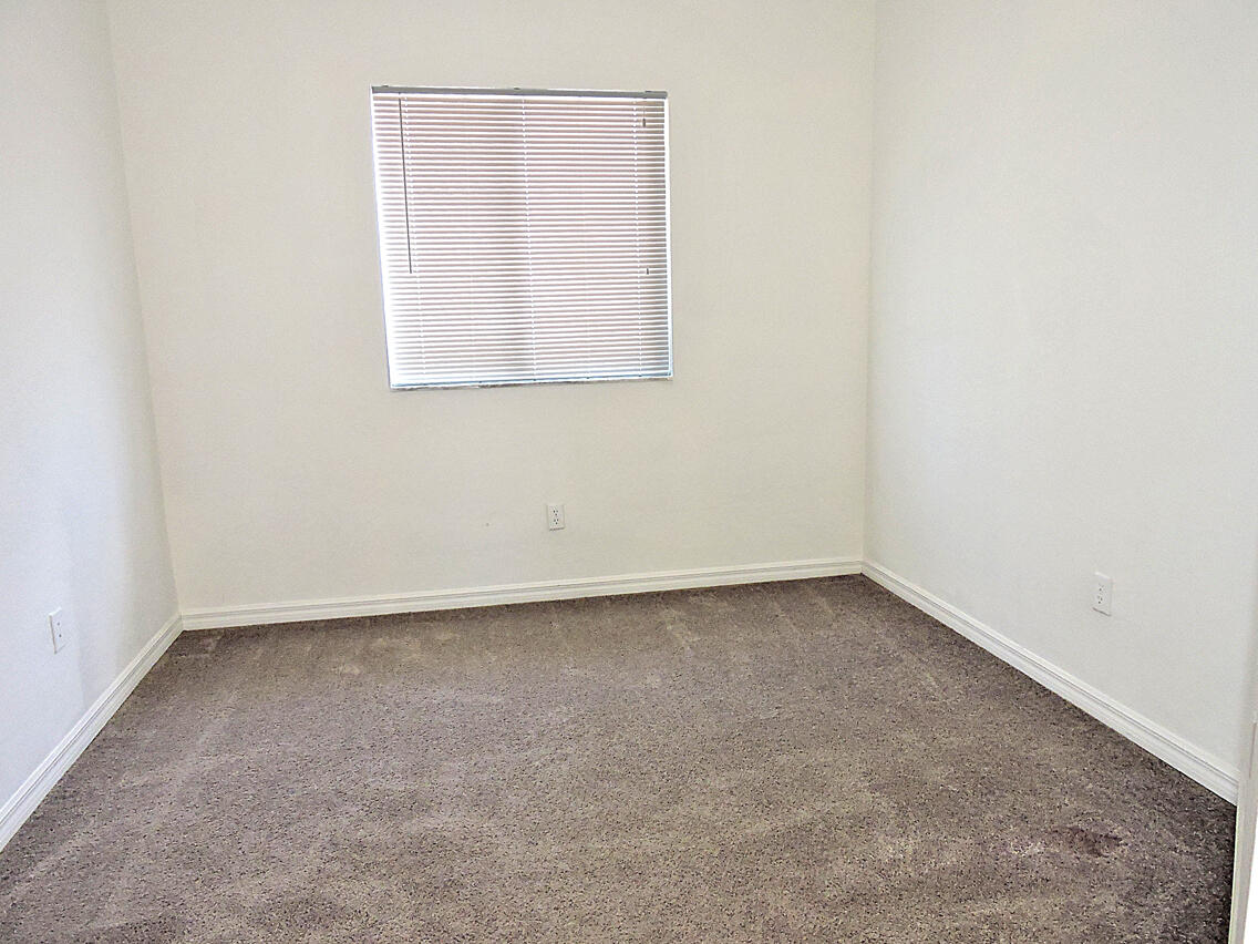 1986 Alamanda Way Riviera Beach, FL 33404 - Photo 41 of 49 an empty room with a window