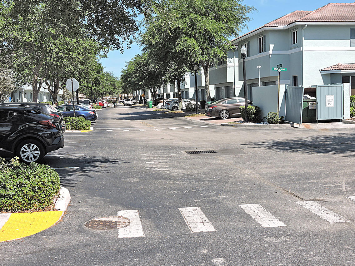 1986 Alamanda Way Riviera Beach, FL 33404 - Photo 49 of 49 a view of road with card parked