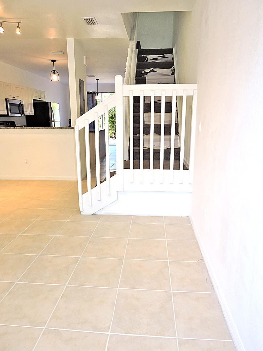 1986 Alamanda Way Riviera Beach, FL 33404 - Photo 8 of 49 a view of a living room with kitchen area
