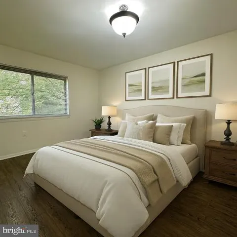 a bedroom with bed and window