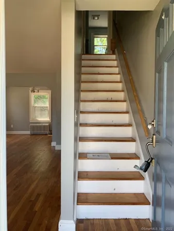 a view of entryway with wooden floor