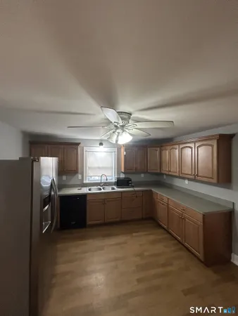 a kitchen with refrigerator and window